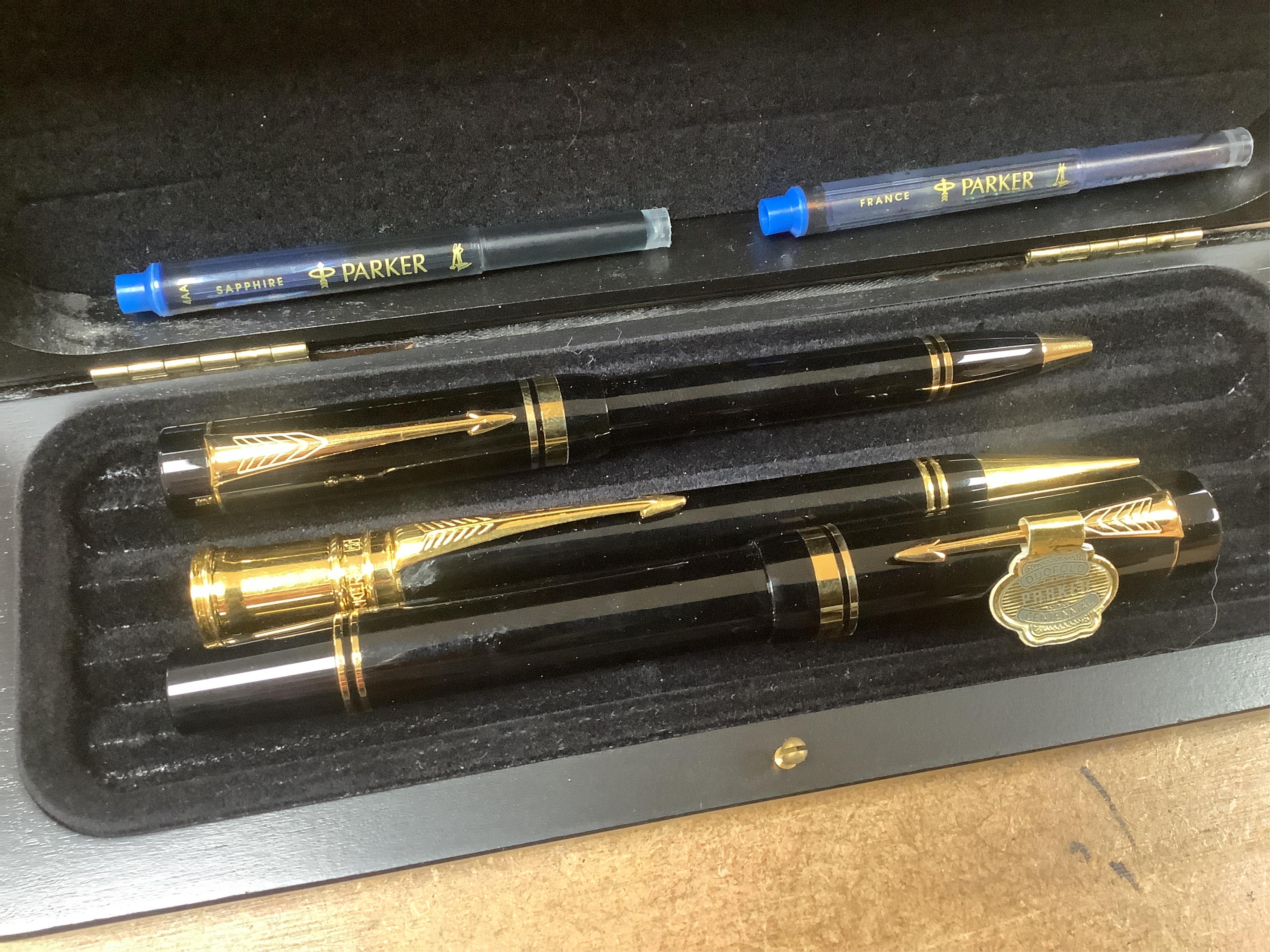 A quantity of various pens to include Parker Duofold and two Parker pen cases. Condition - varies